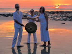 playing the gong on the beat at the gong yoga vacation retreat in costa rica