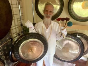 mehtab holding gongs and mallets with gloves