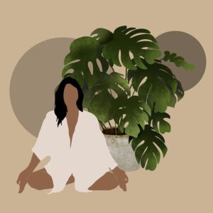 meditating woman sitting in front of a plant